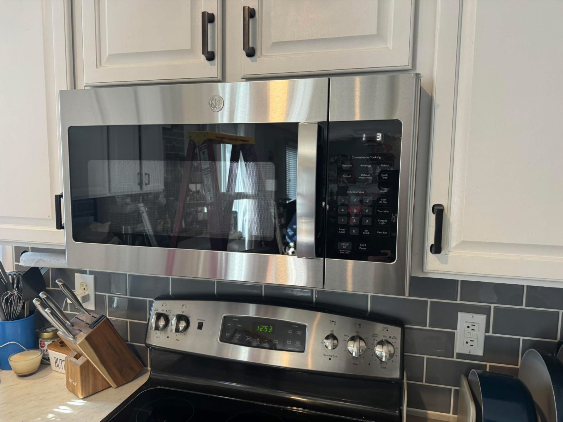 GE over-the-range microwave installation in a Fishers IN kitchen